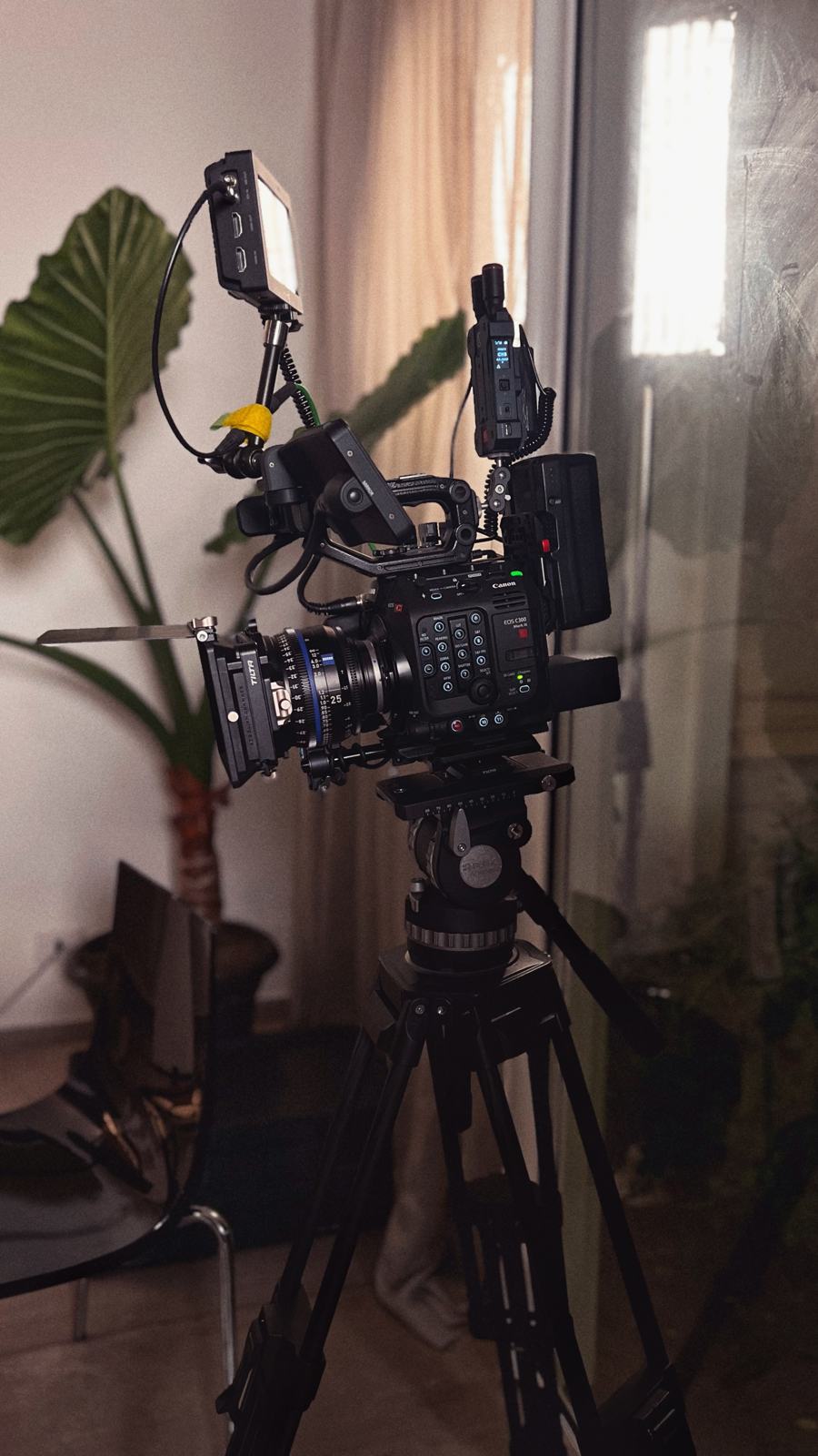 A cinema camera on a tripod, ready to shoot